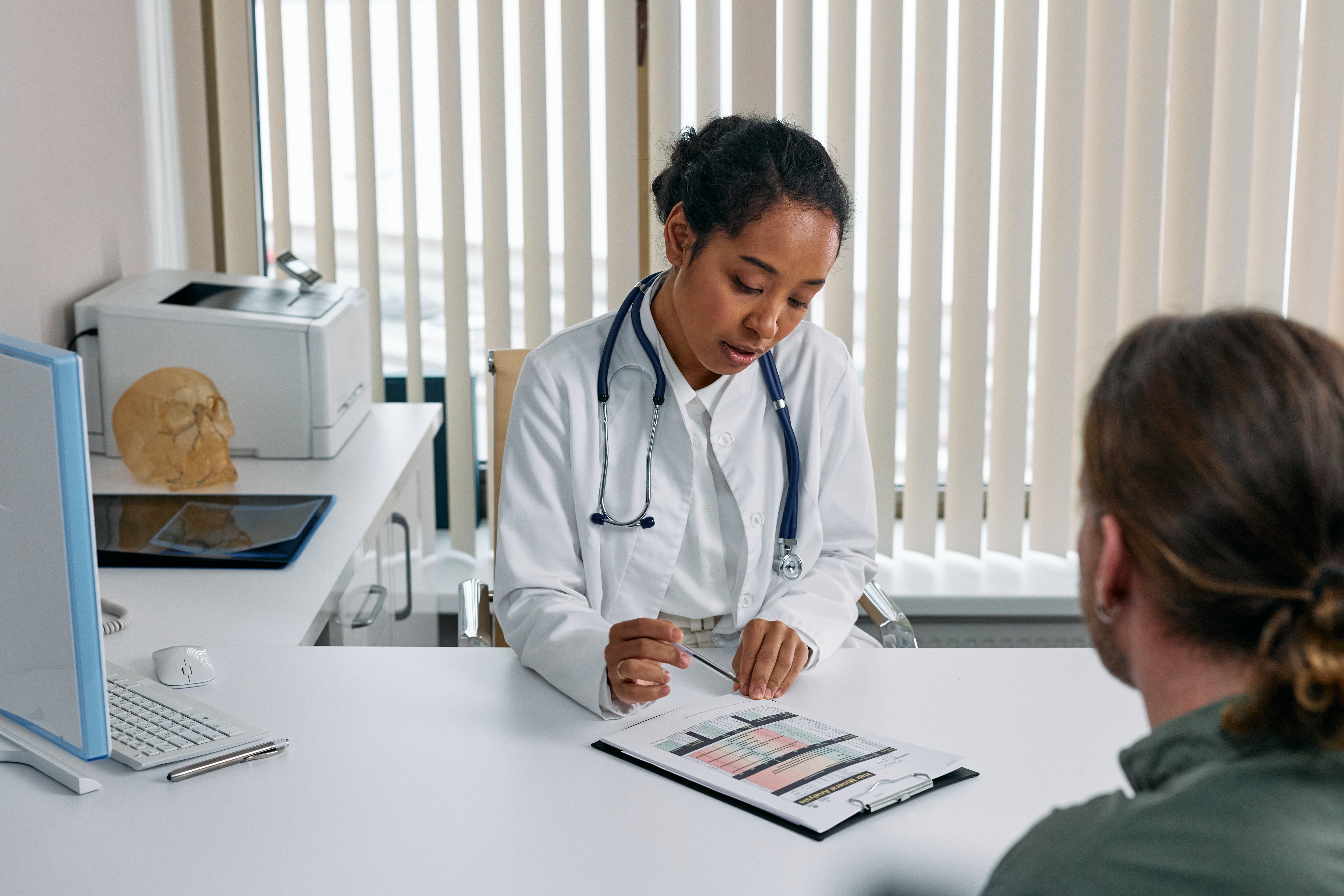 Female clinician consulting patient